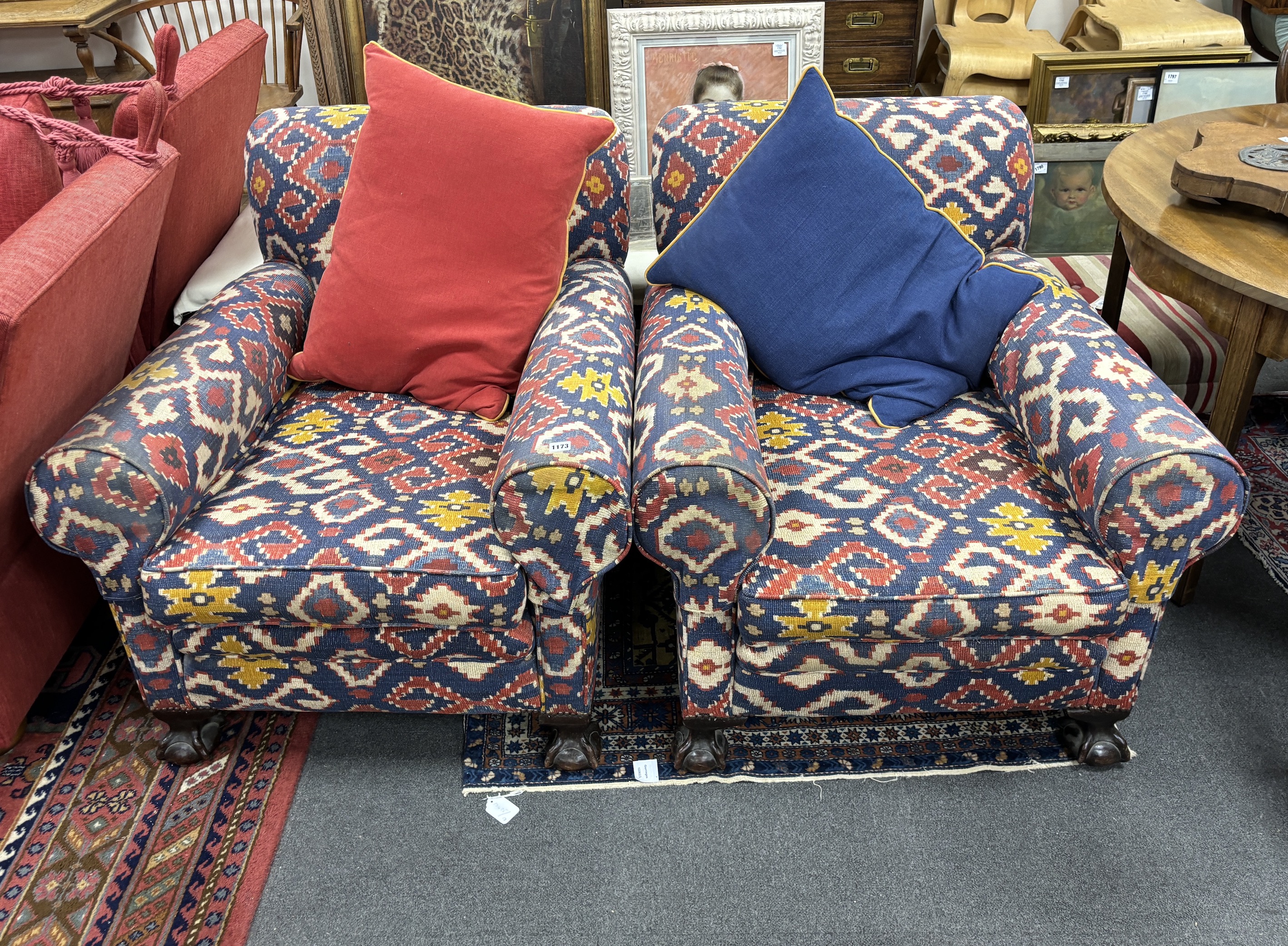 A pair of early 20th century club armchairs, Kilim style upholstered, width 90cm, depth 98cm, height 82cm